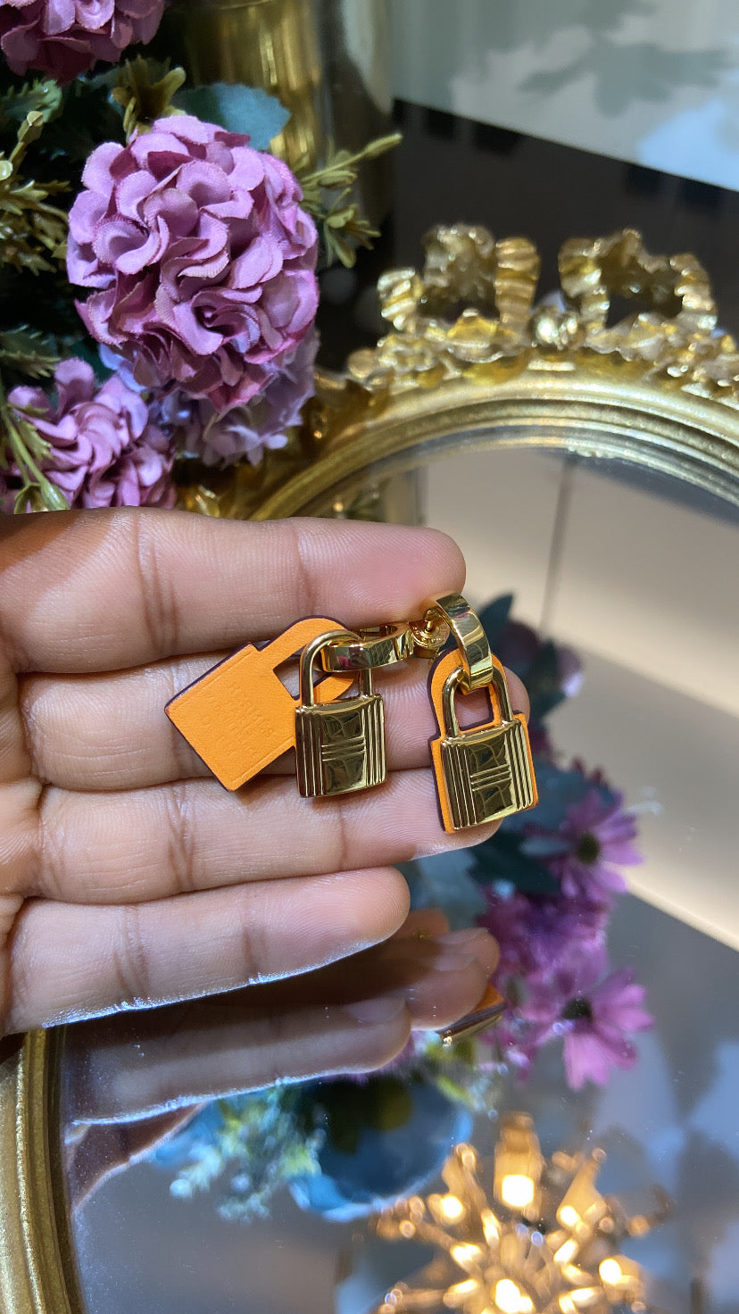 H ORANGE LOCK EARRING