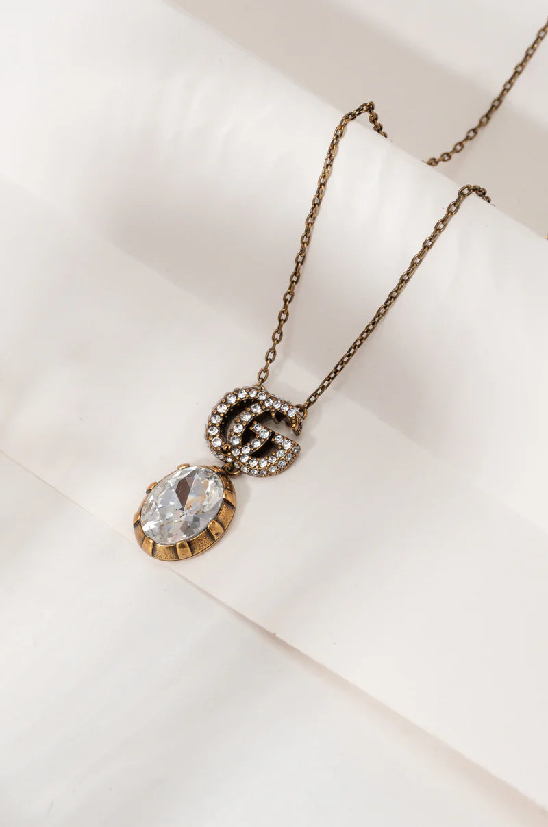 GG CRYSTAL PENDANT + EARRING