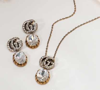 GG CRYSTAL PENDANT + EARRING