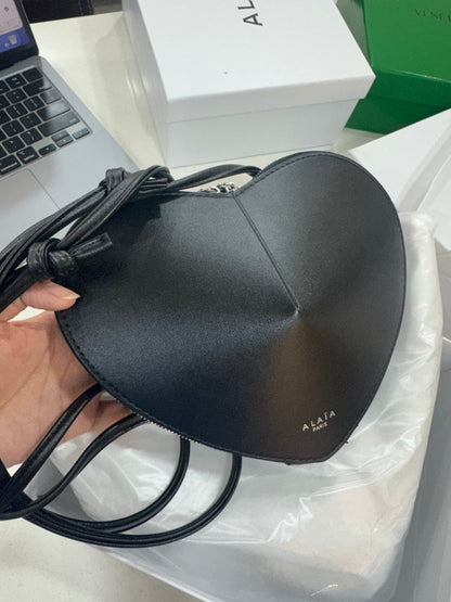 ALAIA heart-shaped SLING